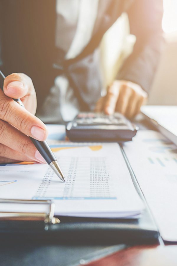 Business concept. Business people discussing the charts and graphs showing the results of their successful teamwork.